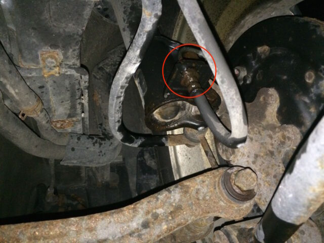 Left rear strut brake line connection sprayed