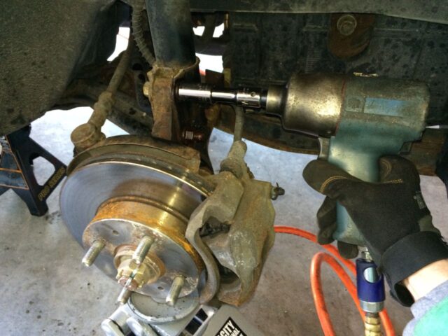 Removing nuts from lower strut bolts