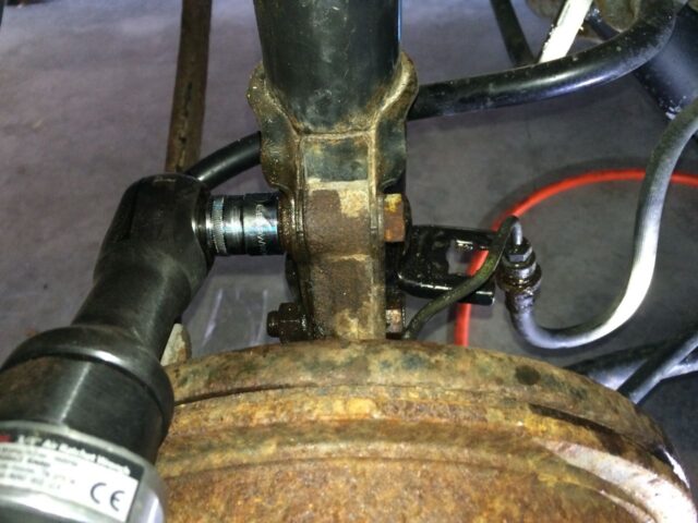 Remove the nuts from the lower strut bolts