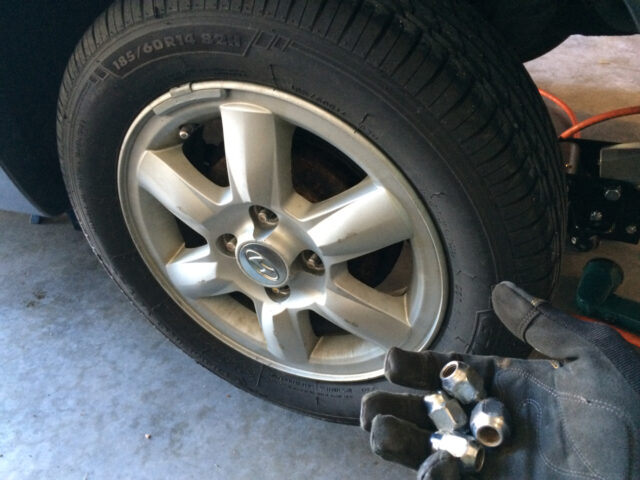 Lug nuts removed from rear wheel