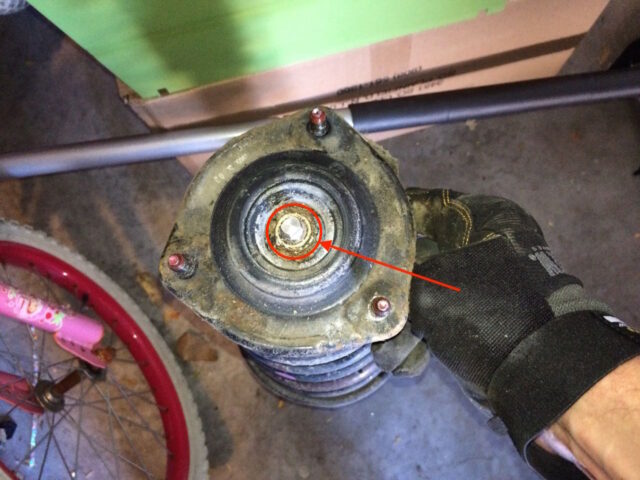 Location of top strut bolt