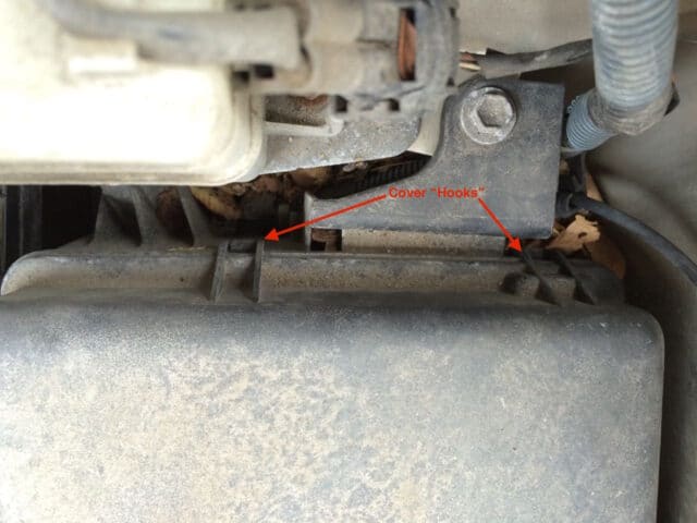 Location of the top hooks that hold the fuse box cover on