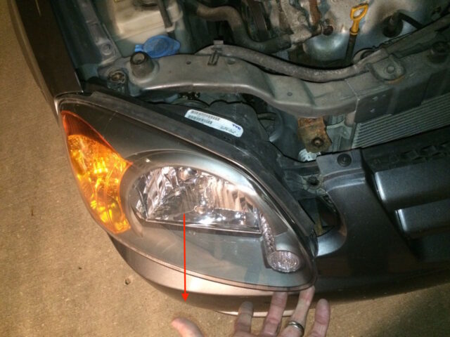 Work the headlamp straight out