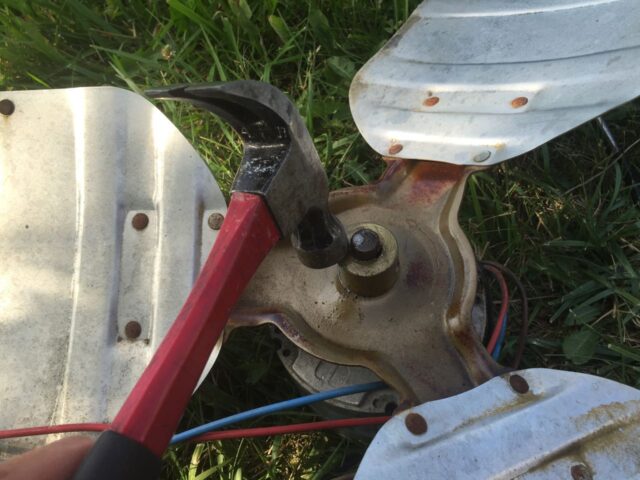 Breaking the fan free by tapping with a hammer