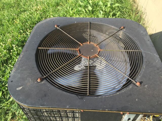 Reinstall the fan grate and nuts to secure it in place