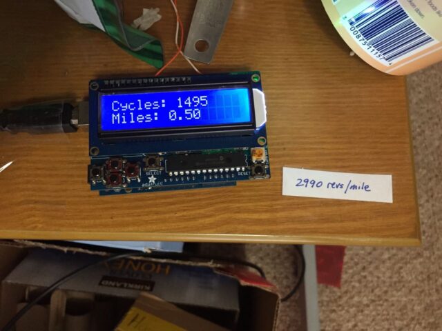 Arduino Hamster Wheel Pedometer display with revolutions on the top line and mileage on the bottom line