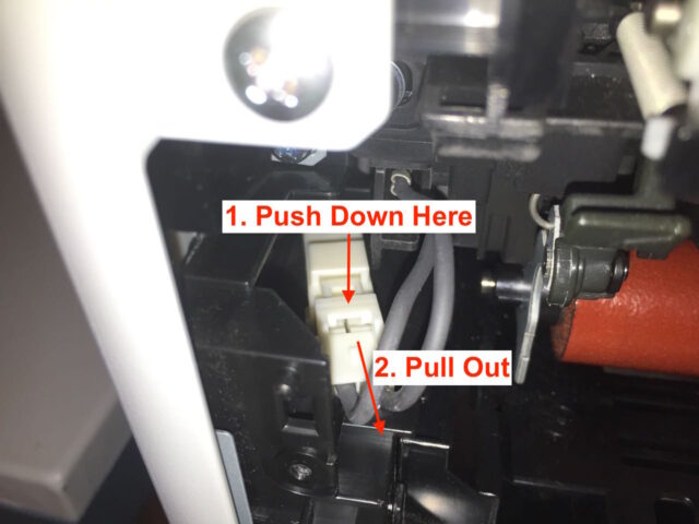 Disconnecting the left fuser electrical connector