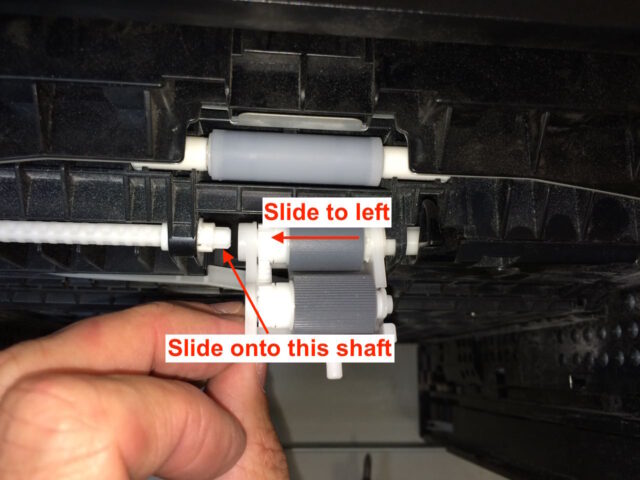 Slide the roller assembly back to the left onto the shaft on the left