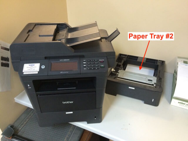 Lift the printer off paper tray #2