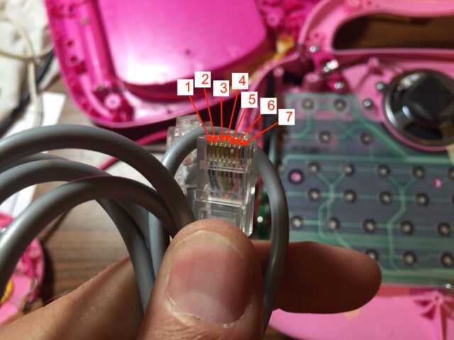 Count of the 7 pins on an ethernet cable showing that Ethernet has 7 conductors