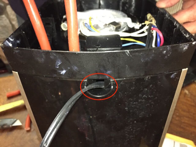 Power cord coming out of hole