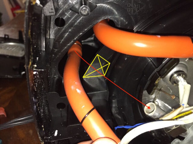 Diagram of the plastic webbing I removed to make a shorter path for the hose