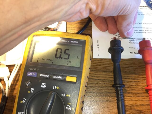 Using a multimeter to determine the normally open leg of the reed switch