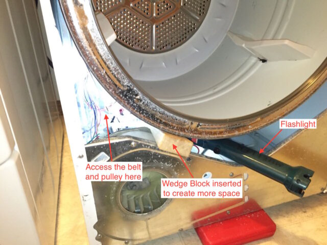 Location to access the belt and tensioner pulley