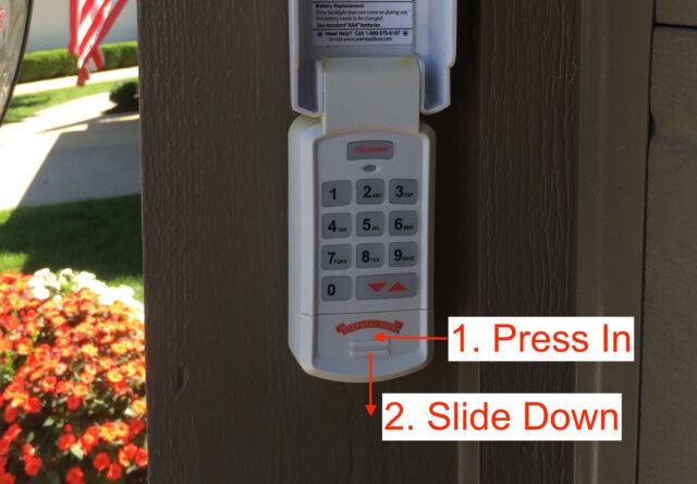 Instructions for opening the battery door of the garage remote keypad