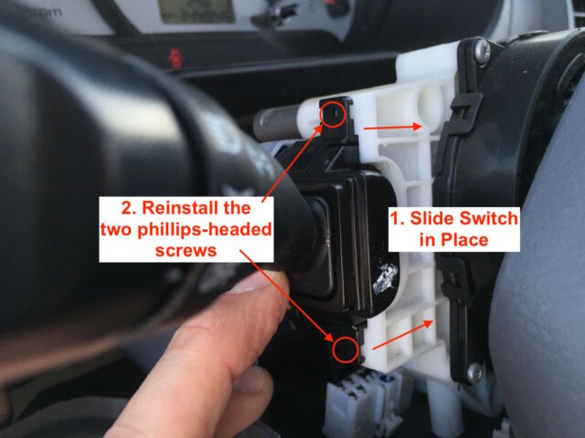 Slide switch into place and reinstall the two screws