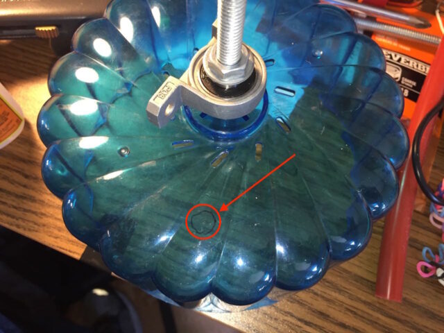 Location marked with permanent marker to glue magnet on hamster wheel