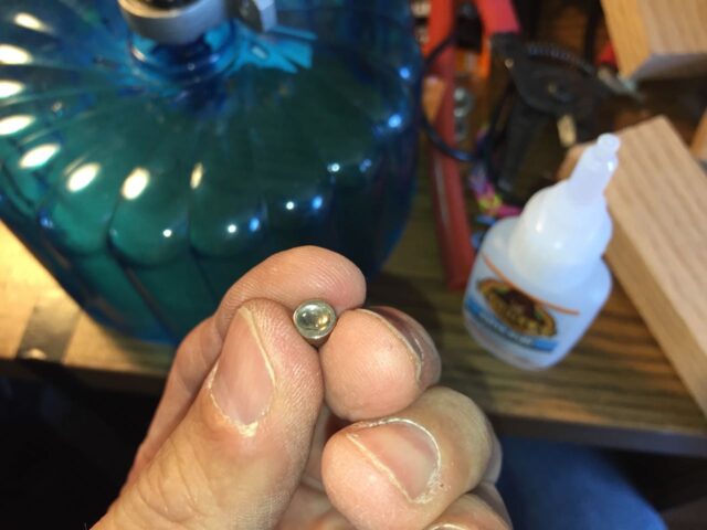 bead of superglue on magnet