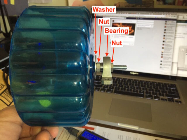 Diagram of the hamster wheel bolted to the bearing with a washer and nuts