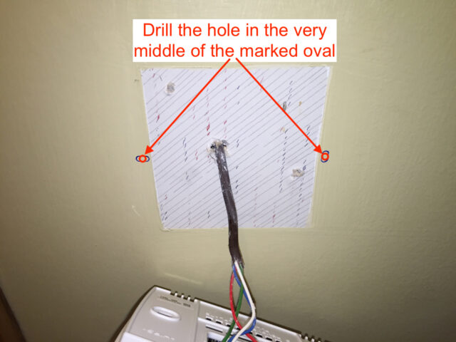 Drill in the center of the oval hole markings.