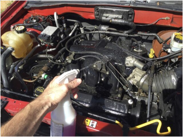 Spray engine cleaner over entire engine compartment