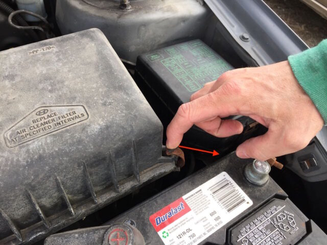 Prying off the air filter box spring latch