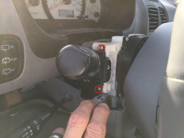 Location of turn signal headlight switch screws