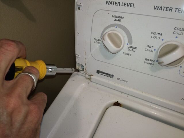 Kenmore 90 Series Washer Fills Slowly-Reinstalling Left Control Panel Screw