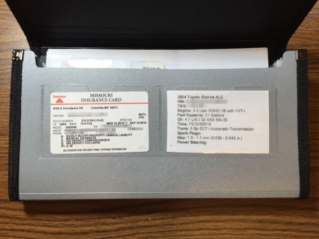 Picture of insurance card and custom vehicle info card in two clear pockets on front of organizer