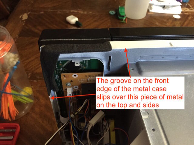 The case groove will slip over these metal tabs
