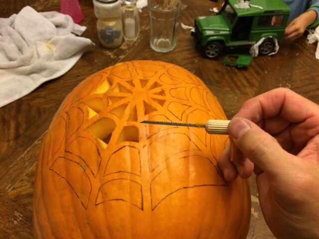 Using my homemade pumpkin carving tool