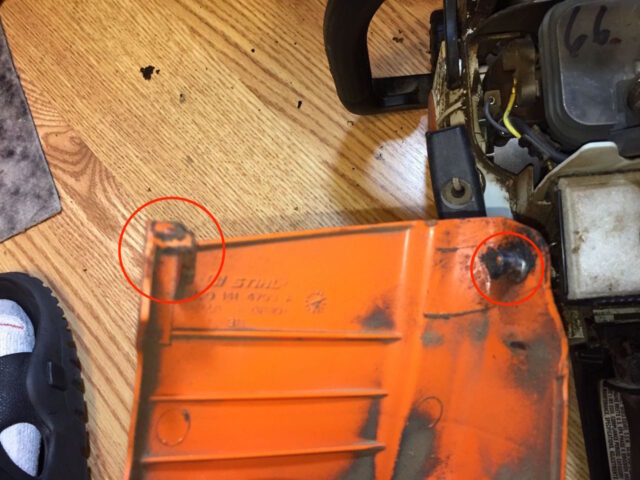 Location of hooks on top cover of chainsaw