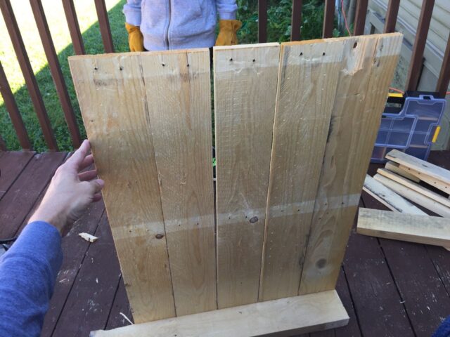 A pallet with one row of nails left to remove