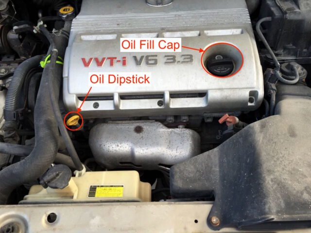Oil dipstick and oil fill cap location