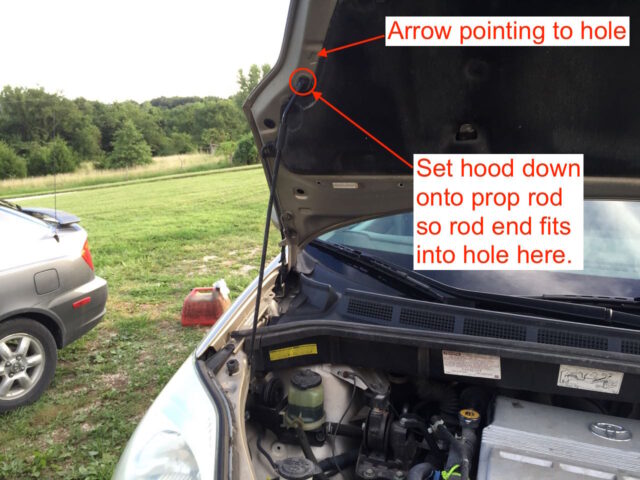 Instructions for inserting the hood prop rod into the hood