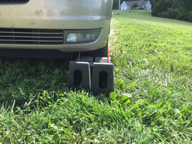 Close up of ramp wedged in front of tire