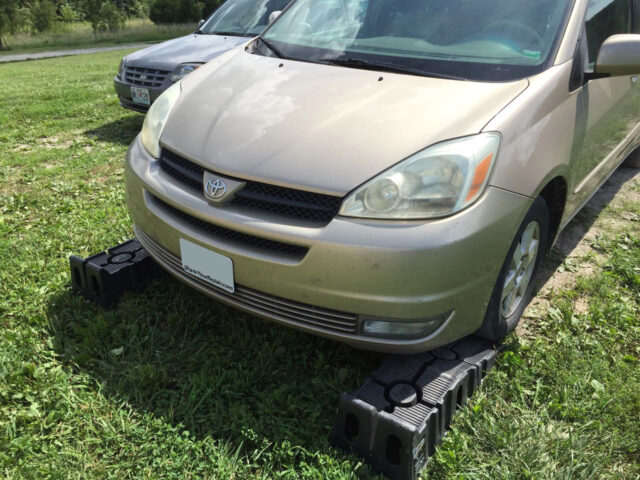 Ramps inserted directly in front of tires