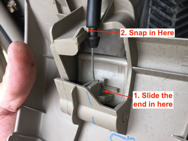 Illustration showing how to reconnect the hood cable to the hood latch