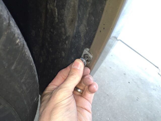 Reinstalling the wheel well clip center pins