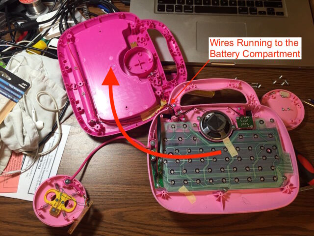 How to lay the lower case to the side with the battery wires attached