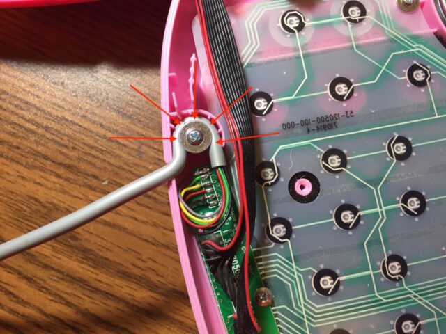 Diagram of mouse cable installed in laptop case with retention screw