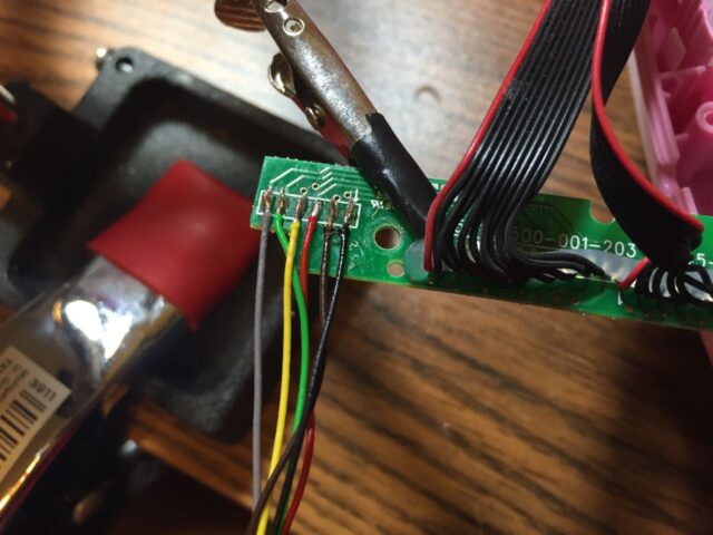 The new cable soldered to the small laptop board