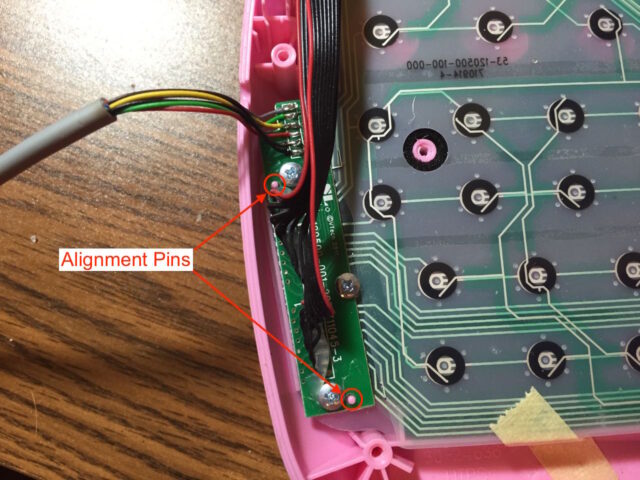 Mount the small laptop circuit board in place, be aware of the alignment pins